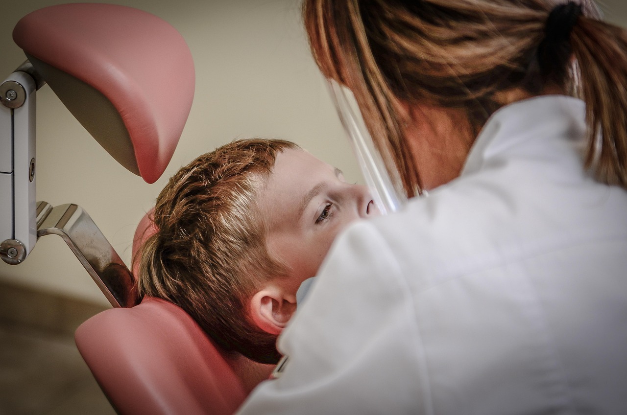 Dental implant consultation between a dentist and patient planning implant treatment
